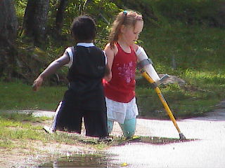 harvey & charlotte playing in puddles - camp no maine