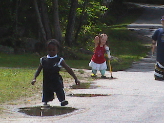 harvey & charlotte playing in puddles - camp maine 09